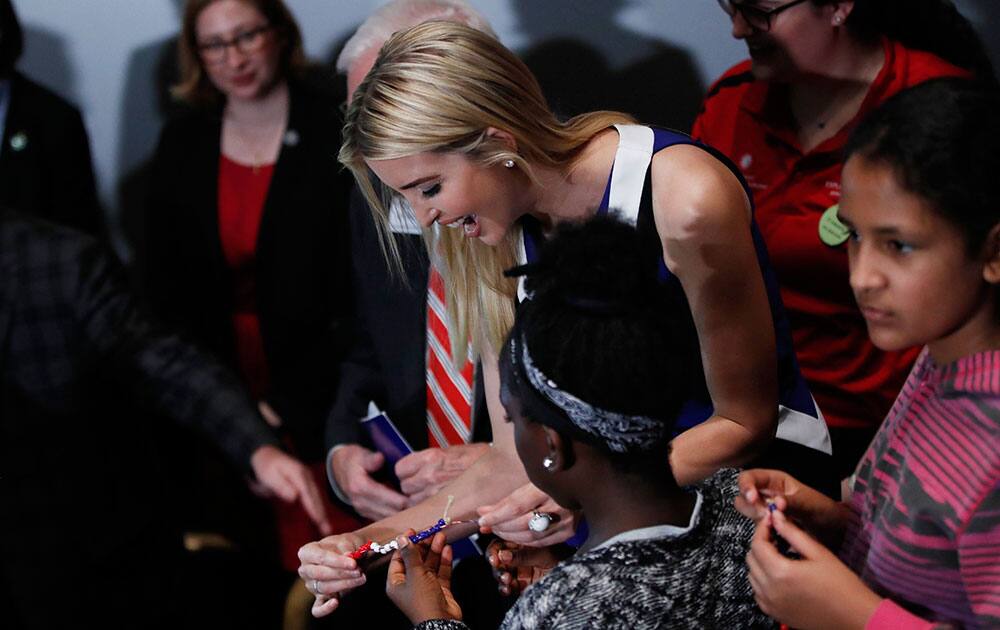 Ivanka Trump helps female students with their project at the Smithsonians National Air and Space Museum