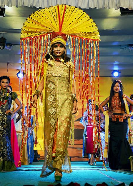 A model catwalks on the ramp in a traditional attire at a fashion show