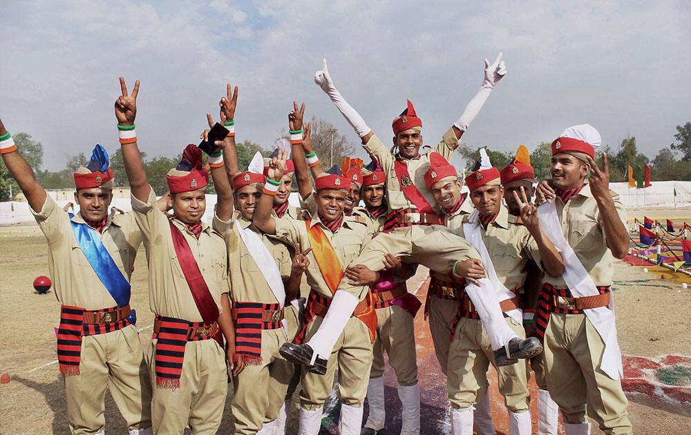 Police personnel pose for a group photograph after passing out parade of PAC