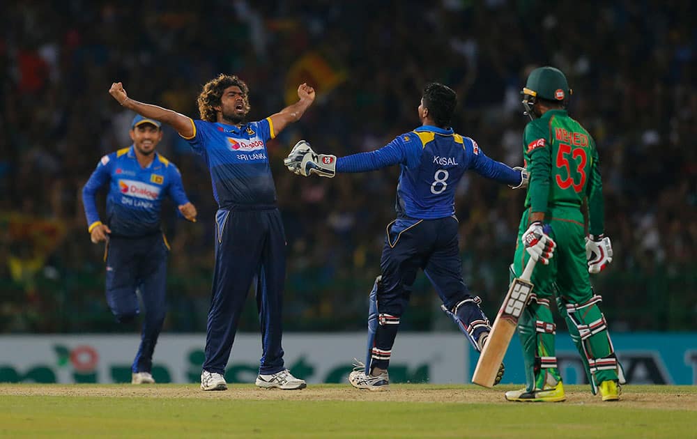 Lasith Malinga celebrates taking the hat trick wicket