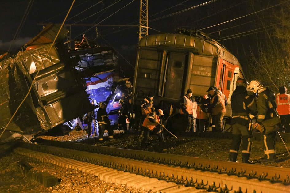 employees examine a train