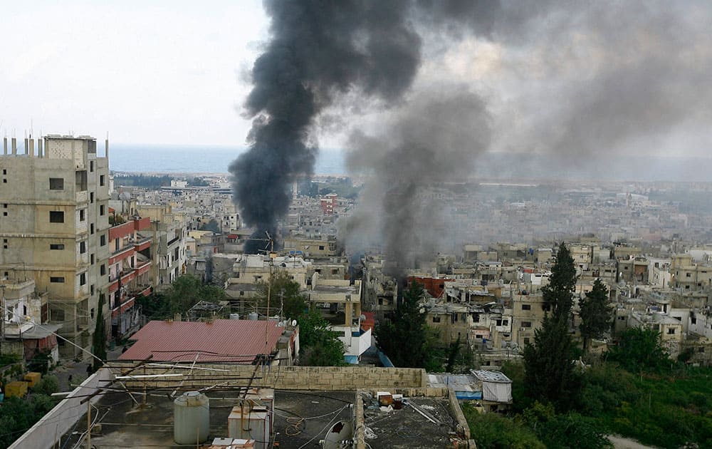 Smokes rise during a clashes that erupted between the Palestinian Fatah Movement and Islamists