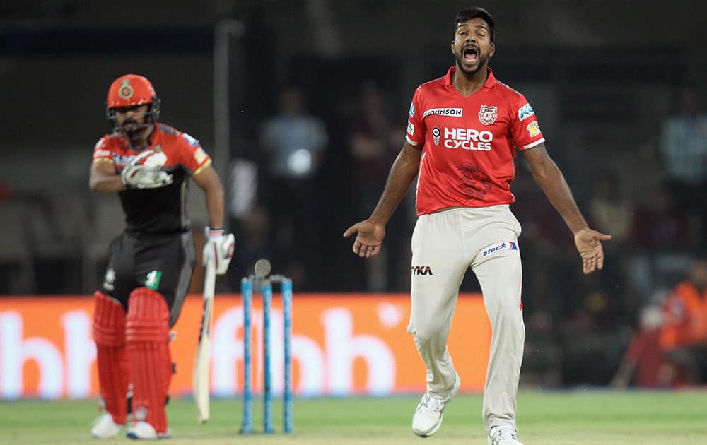 bowler Varu Aaron celebrates wicket of RCB batsman Kedar Jadhav