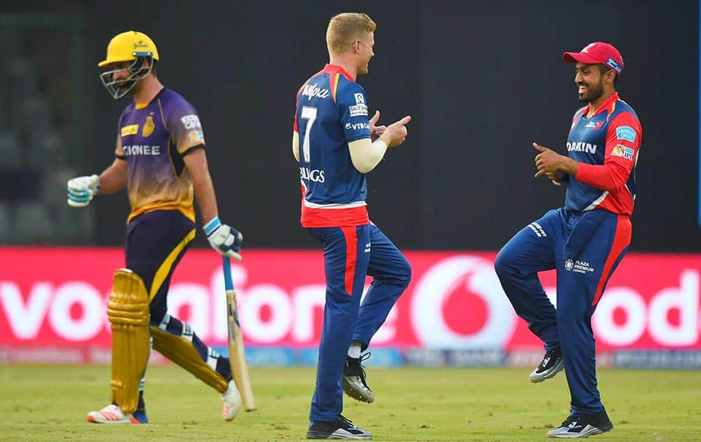 Delhi Daredevils player Sam Billings celebrates with team members after dismissing KKR batsman De Grandhomme