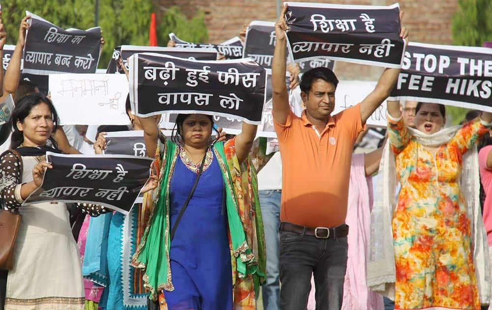 Guardians protest against fee hike during a program at a school at Palam Vihar in Gurugram