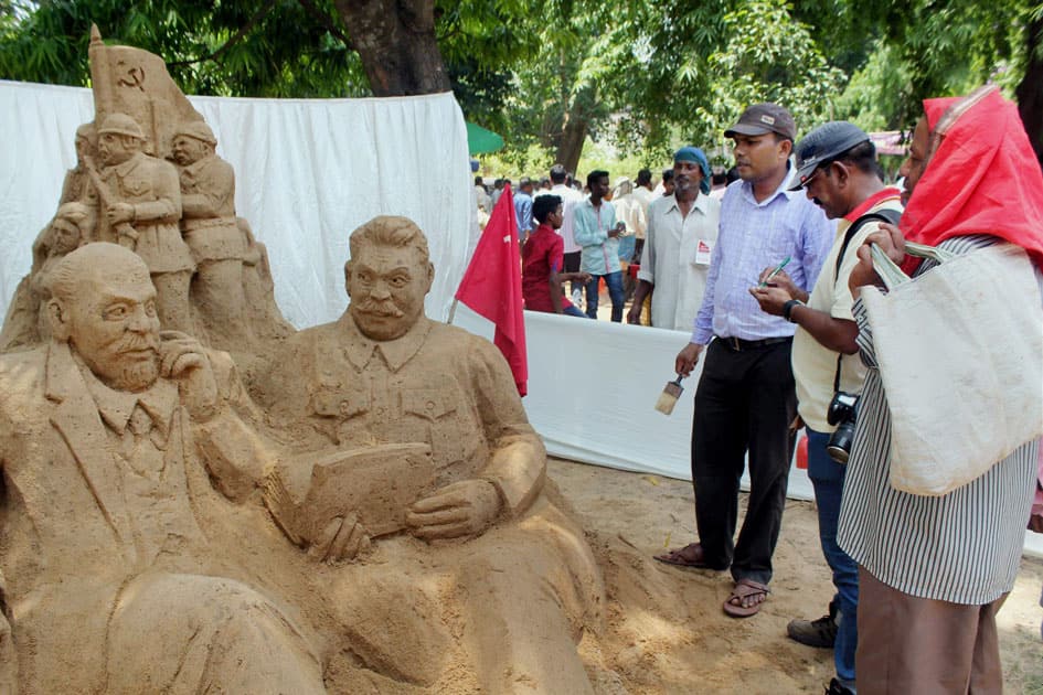 An artist creates a sand sculpture in Bhubaneswar