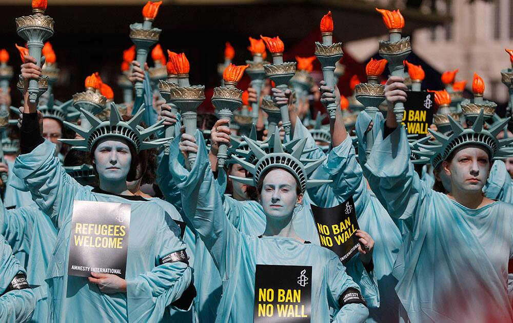 demonstrate outside the US Embassy in London