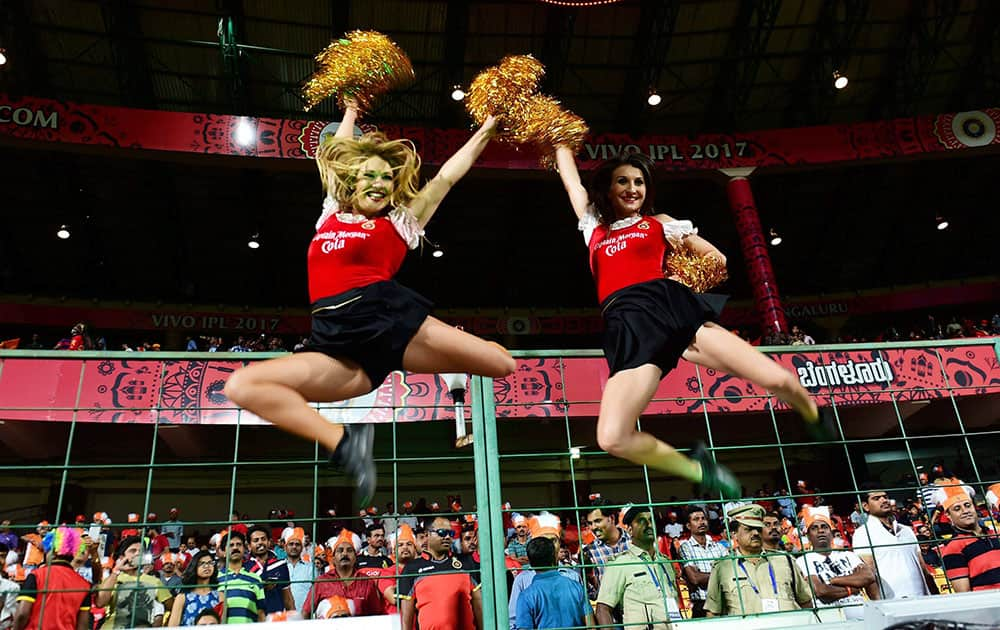 RCB cheerleaders perform before the start of IPL match against Gujarat Lions