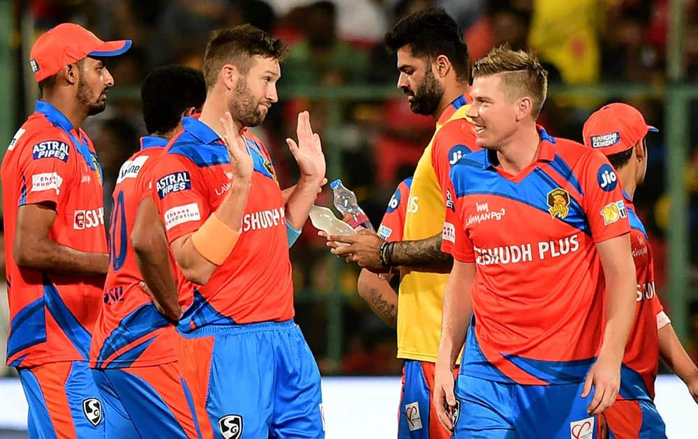 Gujrat Lions Andrew Tye celebrates the wicket of Chris Gayle during the IPL 10