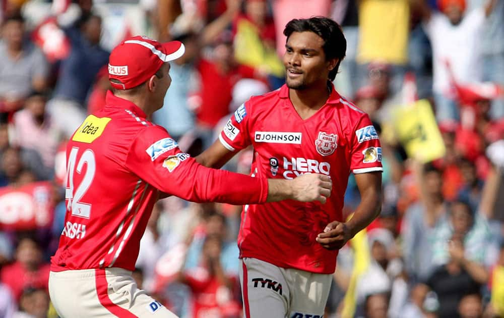 Sandeep Sharma celebrating with his teammates the wicket of Delhi Daredevil batsman Sanju Samson