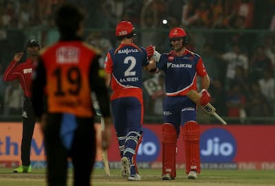 Corey Anderson and Chris Morris celebrate after winning