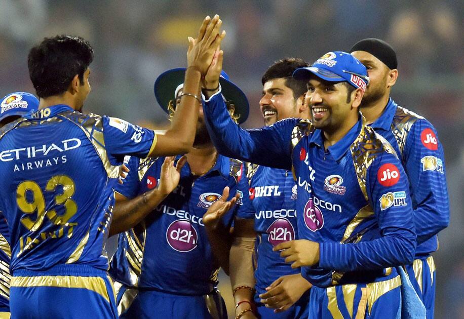 Karan Sharma celebrates with captain Rohit Sharma Karan Sharma celebrates with captain Rohit Sharma