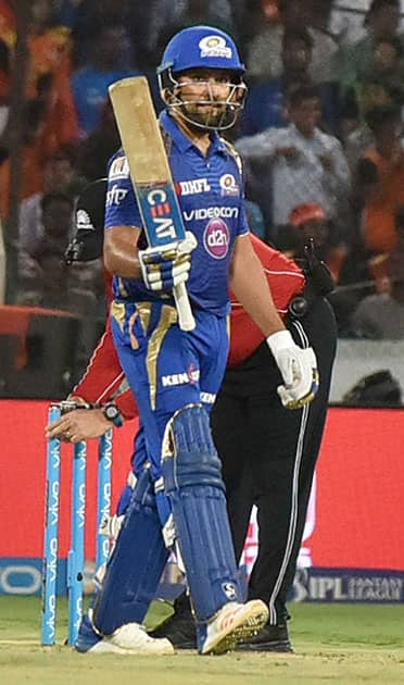 Rohit Sharma celebrates his half century during an IPL cricket match