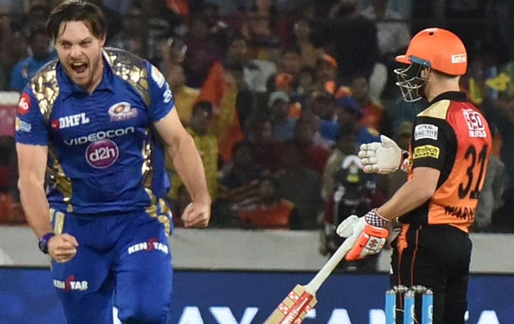 Mitchell McClenaghan celebrates wicket of David Warner