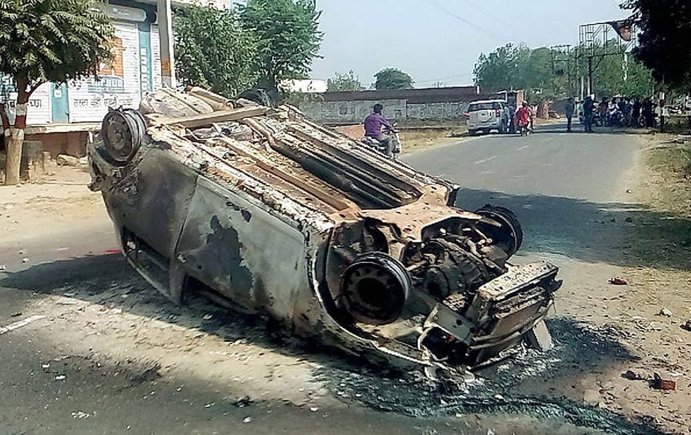 A damaged car after a clash in Saharanpur