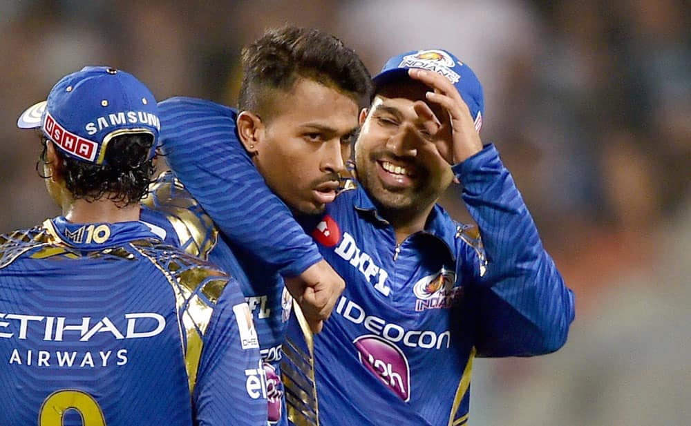 Rohit Sharma celebrates with team mate H.Pandya