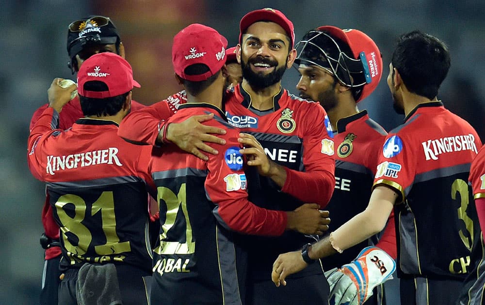 Virat Kolhli with teammates celebrate their win over Delhi Daredevils during an IPL match Virat Kolhli with teammates celebrate their win over Delhi Daredevils during an IPL match