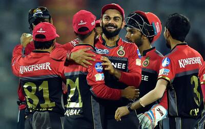 Virat Kolhli with teammates celebrate their win over Delhi Daredevils during an IPL match