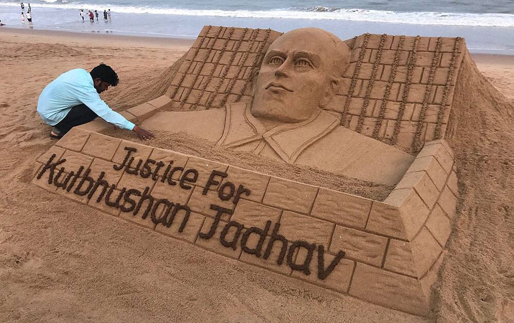 Sudarsan Patnaik creates a sand sculpture with message justice for Kulbhusan Jadhav Sudarsan Patnaik creates a sand sculpture with message justice for Kulbhusan Jadhav