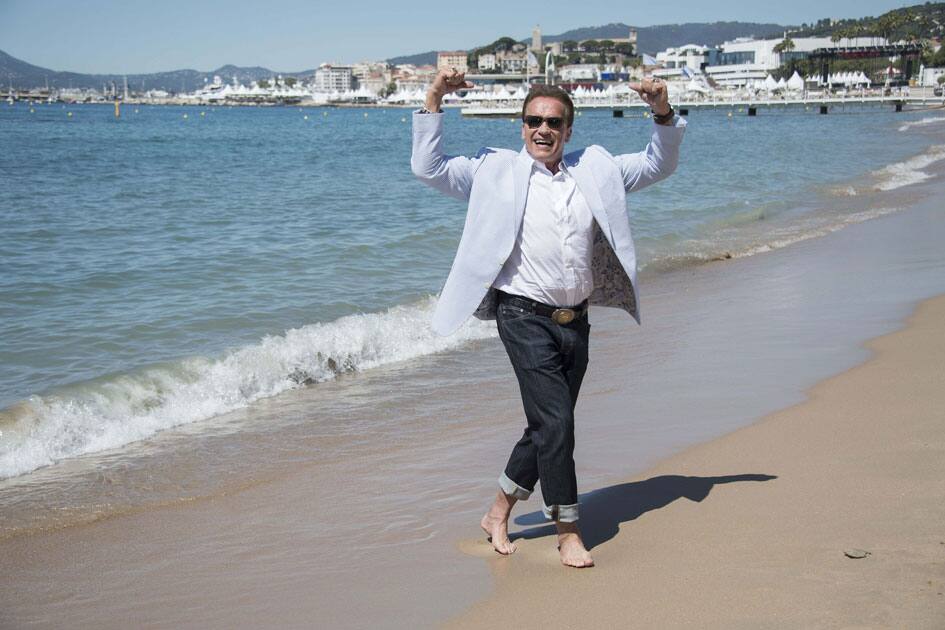 Actor Arnold Schwarzenegger poses for photographers