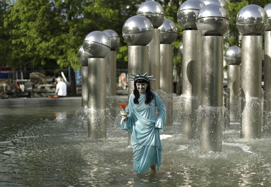 A protester dressed as the Statue of Liberty A protester dressed as the Statue of Liberty