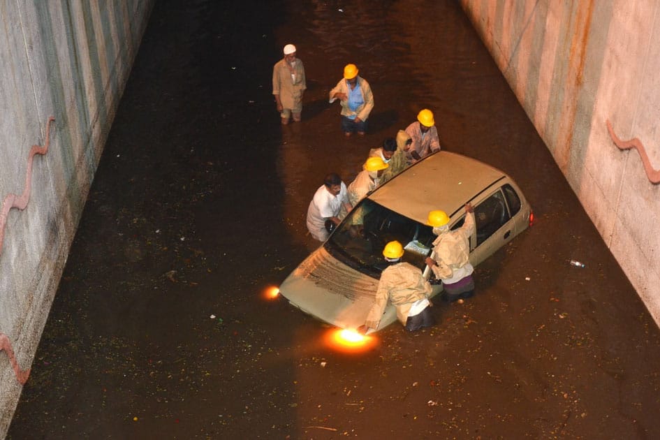 A car gets stuck in waterlogged underpass in Bengaluru