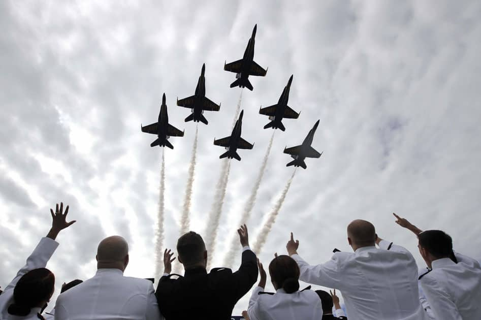 U.S. Navy Blue Angels perform a flyover above graduating U.S. Naval Academy midshipmen