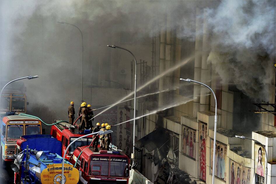 Fire personnel dousing a massive fire that broke out at a textiles shops