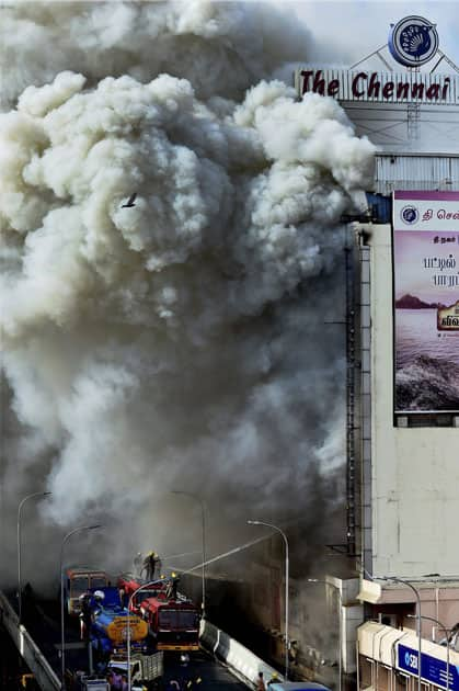 Fire personnel dousing a massive fire that broke out at a textiles shops