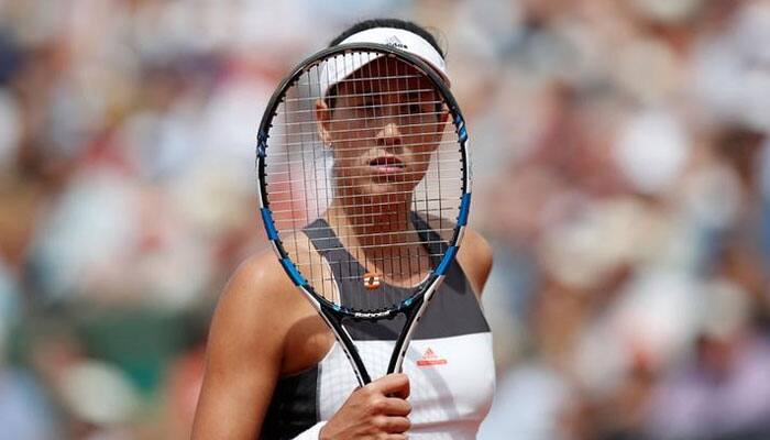 French Open: Defending champion Garbine Muguruza knocked out by Kristina Mladenovic