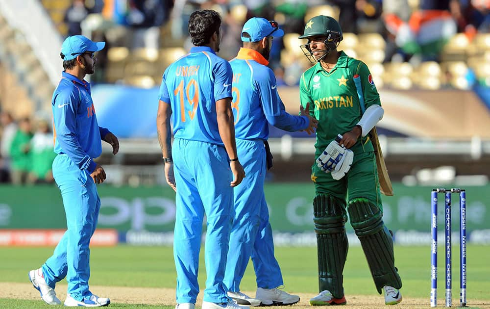 Virat Kohli shakes hand with Pakistans Shadab Khan at the end of the ICC Champions Trophy match