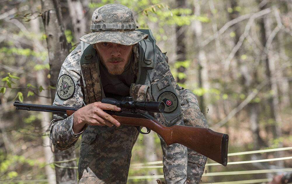 Joshua Goodman navigates through obstacles in the woods in Jackson