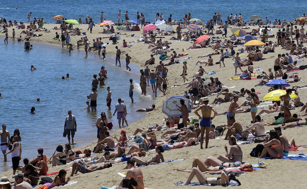 People sunbathe On a beach