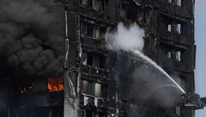 Fire engulfs London tower block; at least six dead, more than 70 injured