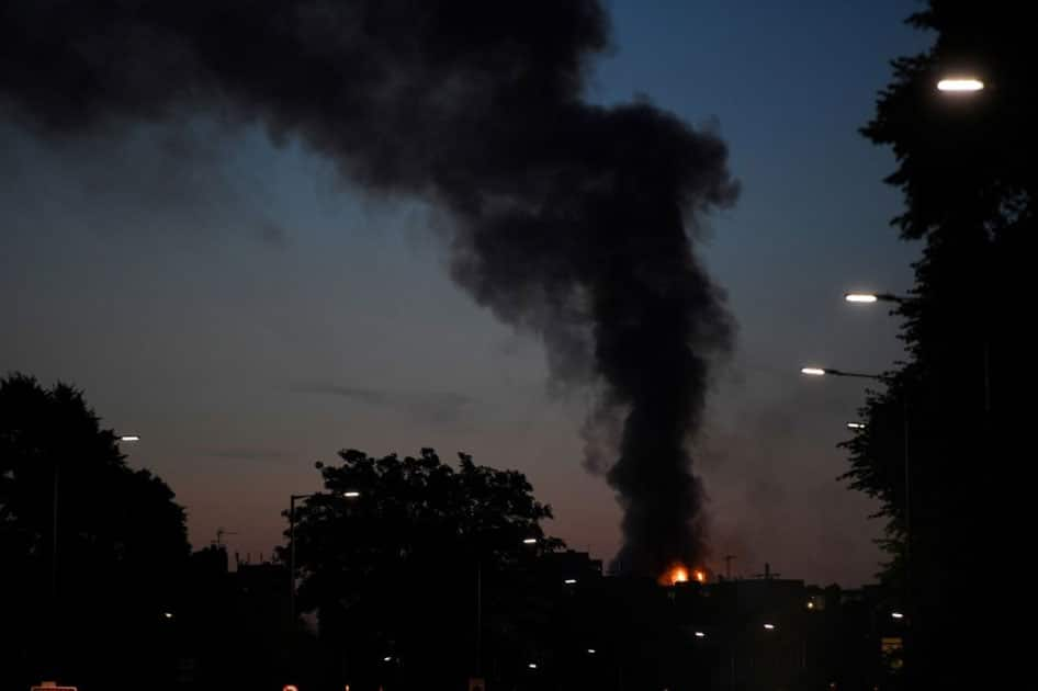 Flames and smoke billow as firefighters deal with a serious fire