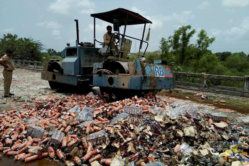 Seized Liquor bottles destroyed in Gujarat