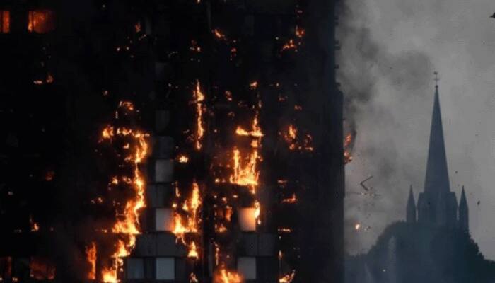 Fire engulfs London tower block, at least 12 dead, dozens injured