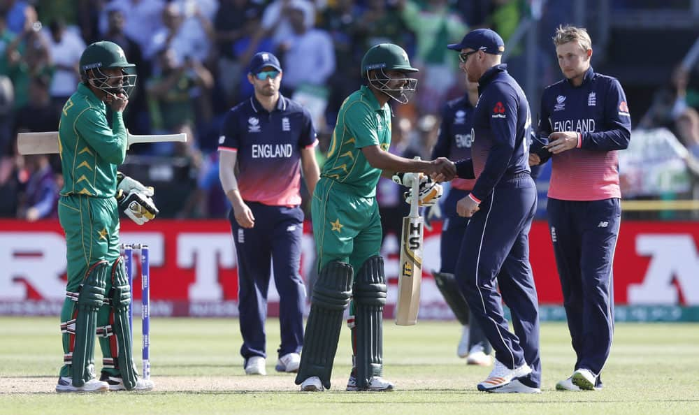 Pakistans Mohammad Hafeez and Babar Azam shakes hands with England players