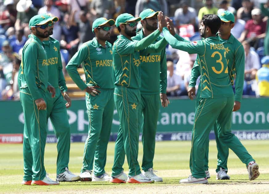 Pakistans players celebrate after taking the wicket