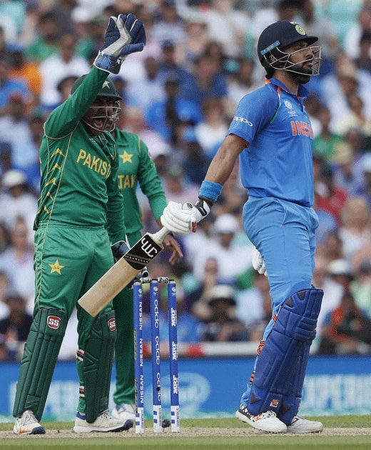 wicket keeper Sarfraz Ahmed celebrates the dismissal of Yuvraj Singh