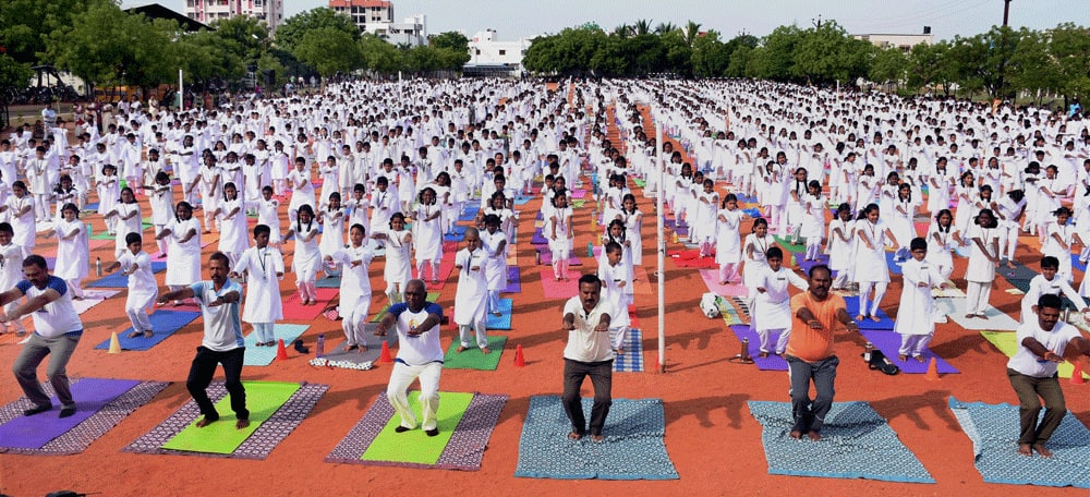 Minister of State for Shipping and Road Transport Pon Radhakrishnan participate in a mass yoga