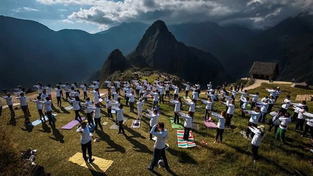 Yoga enthusiasts perform yoga on International Day of Yoga at Machu Picchu