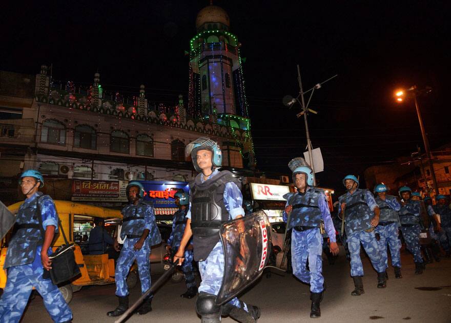 Rapid Action Force personnel conduct a flag march