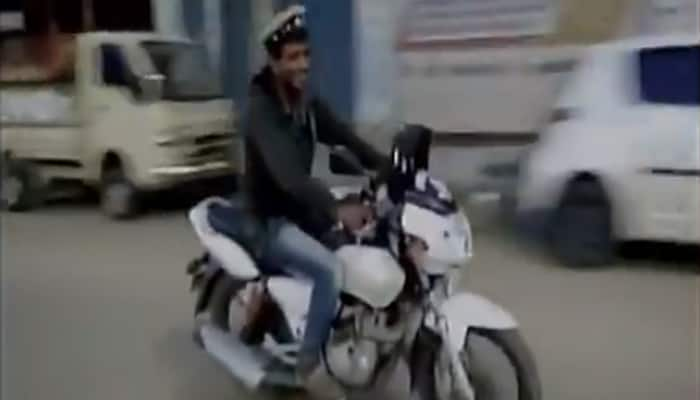 Drunk man in Karnataka steals police bike, cap, gives a tough chase - WATCH