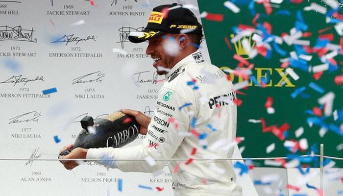 Lewis Hamilton enjoys British Grand Prix win but remains reserved over F1 future
