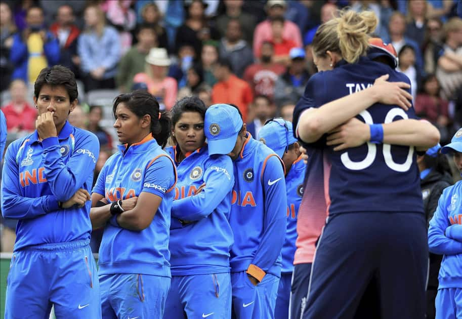 India players stand dejected prior to receiving their runners-up medals