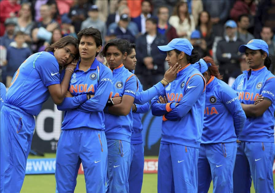 India players stand dejected prior to receiving their runners-up medals