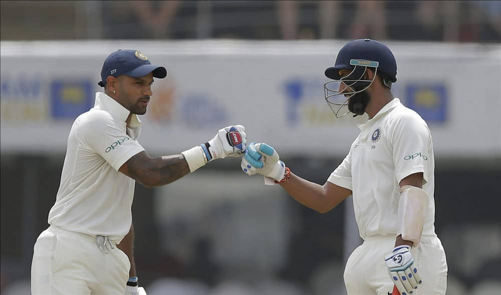 Cheteshwar Pujara and Shikhar Dhawan cheer at each other