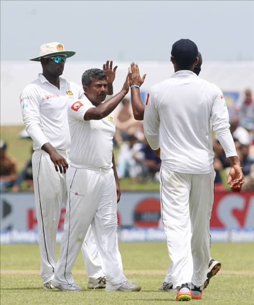 Rangana Herath celebrates fall of a wicket