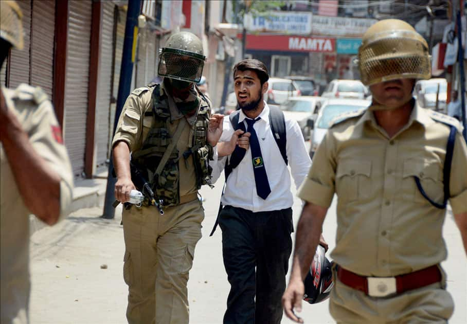 Police arrest a student during clashes